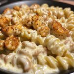 cajun chicken rotini in creamy mozzarella velveeta sauce