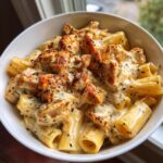 cajun garlic butter chicken rigatoni in cheesy alfredo sauce